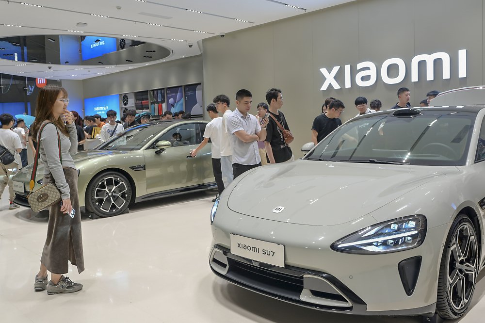 ●高盛看好小米汽車熱銷, 調高小米目標價。圖/中新社 image